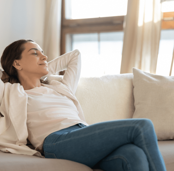 Woman relaxing on sofa.